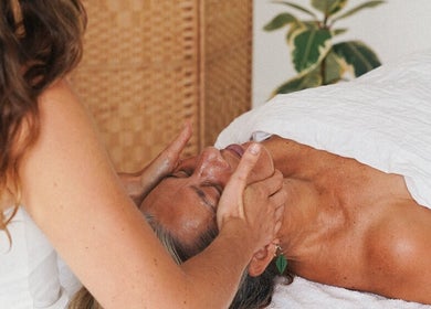 Therapist performing a calming facial massage at Of The Earth - Osteo Hub Mumbles (Tuesdays), Mumbles, Wales, GB.