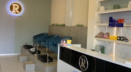 Interior of Rosewood Beauty in Centurion, Gauteng showcasing plush seating and skincare products.