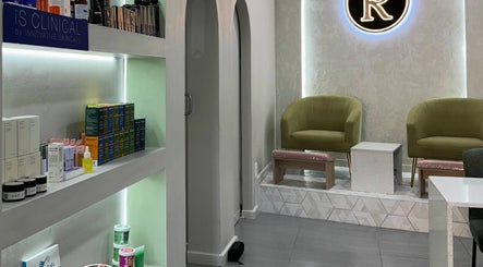 Relaxing lounge at Rosewood Beauty, Centurion, Gauteng, ZA with stylish chairs and shelves of skincare products.