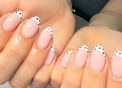 Polka dot French manicure at Beauty By Ella, Tamworth, England, GB creating a chic nail art style.