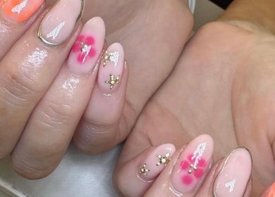 Colorful floral nail art at Beauty By Ella, Tamworth, England, GB, showcasing exquisite designs.