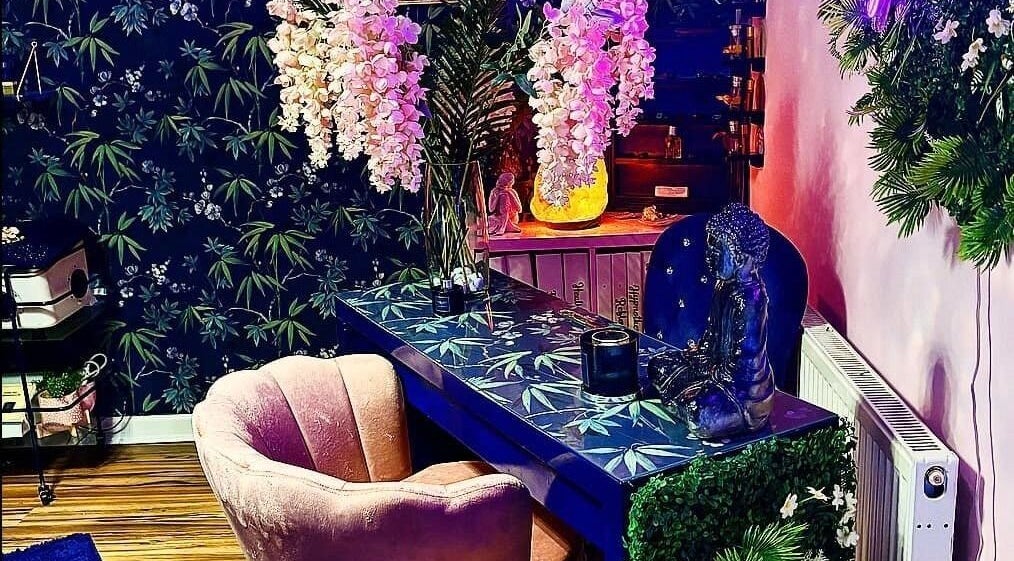 Elegant spa room at Janine Morgan, Lytham St Annes, England, GB, featuring floral decor and calming ambiance.