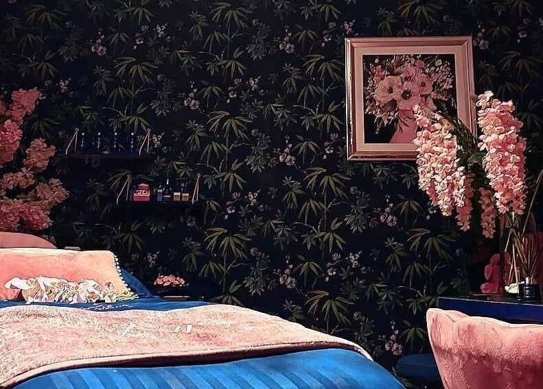 Luxurious treatment room with floral decor at Janine Morgan, Lytham St Annes, England, GB.