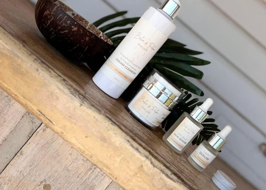 Beauty products displayed at Janine Morgan, Lytham St Annes, England, GB in a serene, rustic setting.