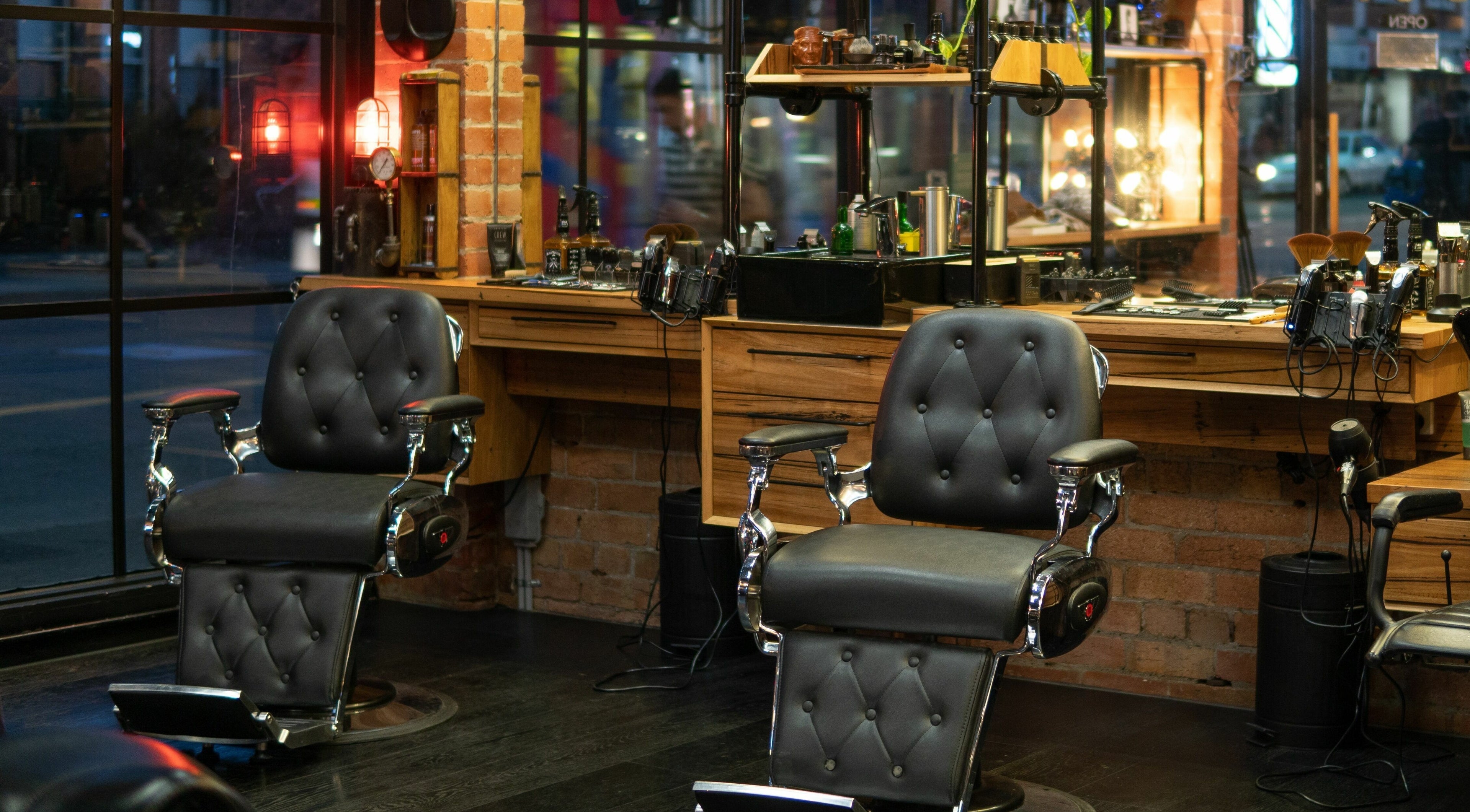 Elegant leather barber chairs at Edward Scissorhands in Melbourne, Victoria, AU, offering a vintage vibe.