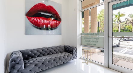 Elegant lobby with plush sofa at Beauty Locks Hair Extensions, North Miami Beach, Florida, US.