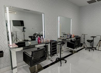 Modern salon interior at Beauty Locks Hair Extensions, North Miami Beach, Florida, US with sleek styling stations.