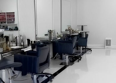 Modern salon interior at Beauty Locks Hair Extensions, North Miami Beach, Florida, US with sleek styling stations.