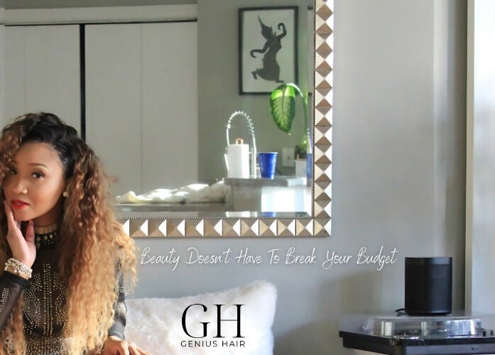 Elegant woman in Genius Hair Collection LLC, College Park GA showcases beauty and style in a mirrored setting.