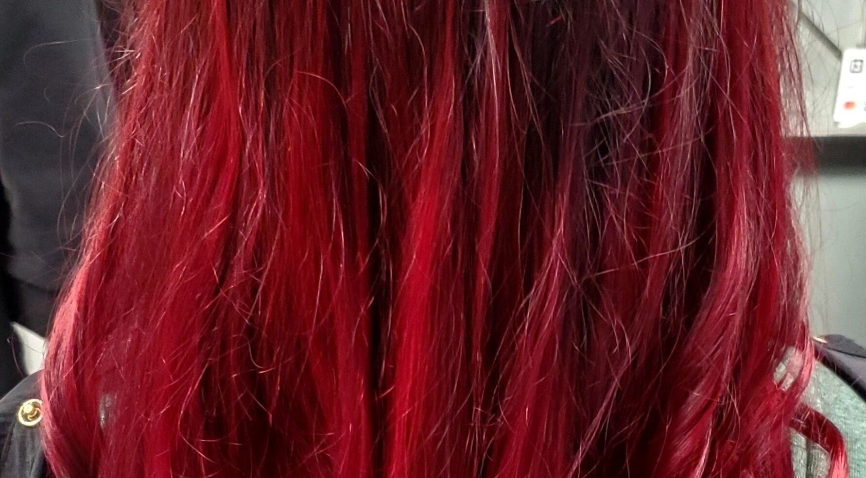 Vibrant red hair styled at Dorothy Kominakis in Valparaiso, Indiana, US.