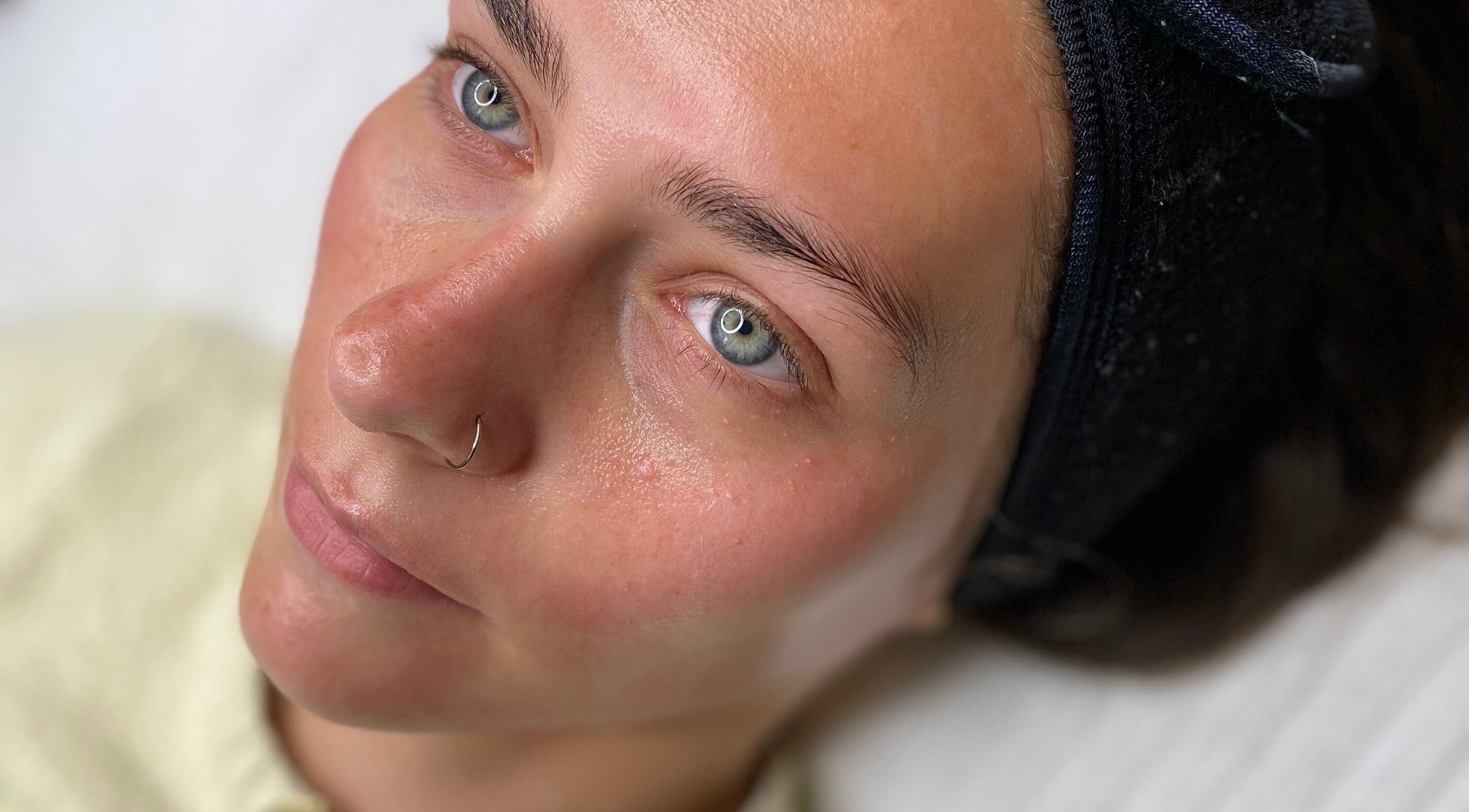 Close-up of a woman's face glowing after a facial treatment at Peak In Beauty, Combs, England, GB.