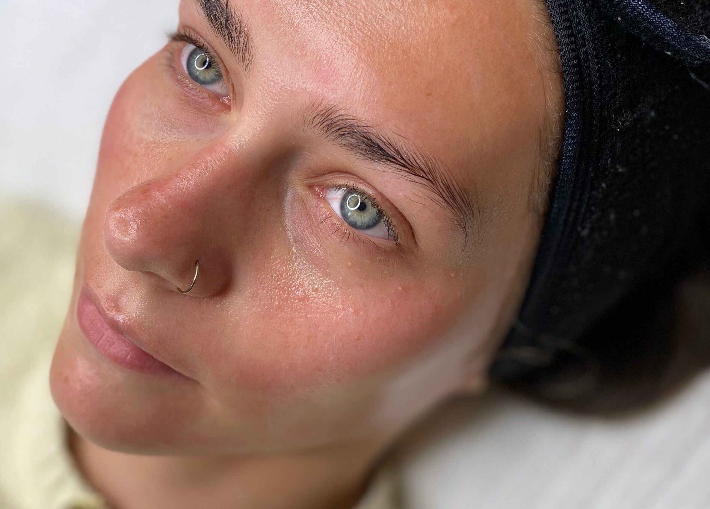 Close-up of a relaxed customer enjoying skincare at Peak In Beauty, Combs, England, GB.
