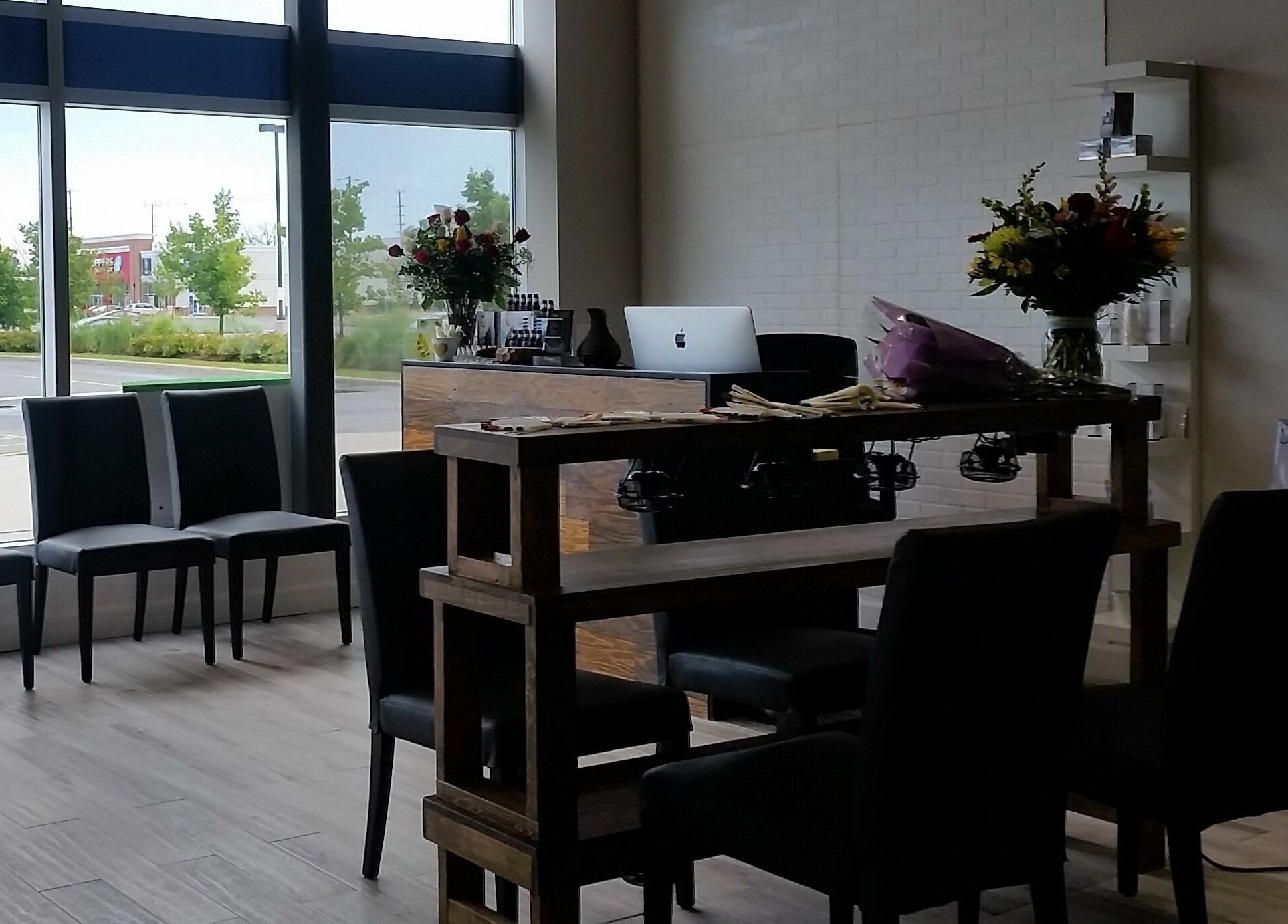 Interior view of Luna Nails and Spa in Ottawa, Ontario, CA, showing elegant waiting area with stylish decor.