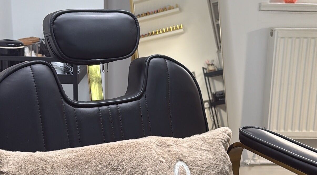 Elegant salon chair at By Melissa Studio, East Kilbride, Scotland, GB, reflecting comfort and style.