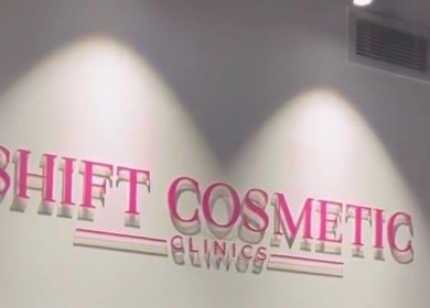 Illuminated SHIFT COSMETIC CLINIC sign on wall in Gladesville, New South Wales, AU.