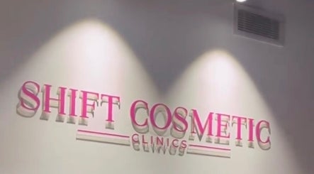 Illuminated SHIFT COSMETIC CLINIC sign on wall in Gladesville, New South Wales, AU.