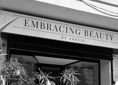 Entrance to Embracing Beauty salon in Iż-żejtun, MT showcasing its welcoming exterior and vibrant greenery.