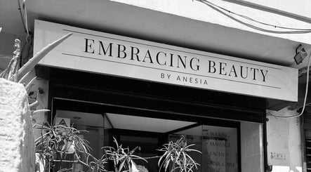 Entrance to Embracing Beauty salon in Iż-żejtun, MT showcasing its welcoming exterior and vibrant greenery.