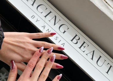 Stylish nail art at Embracing Beauty, Iż-żejtun, MT, showcasing elegant maroon designs.