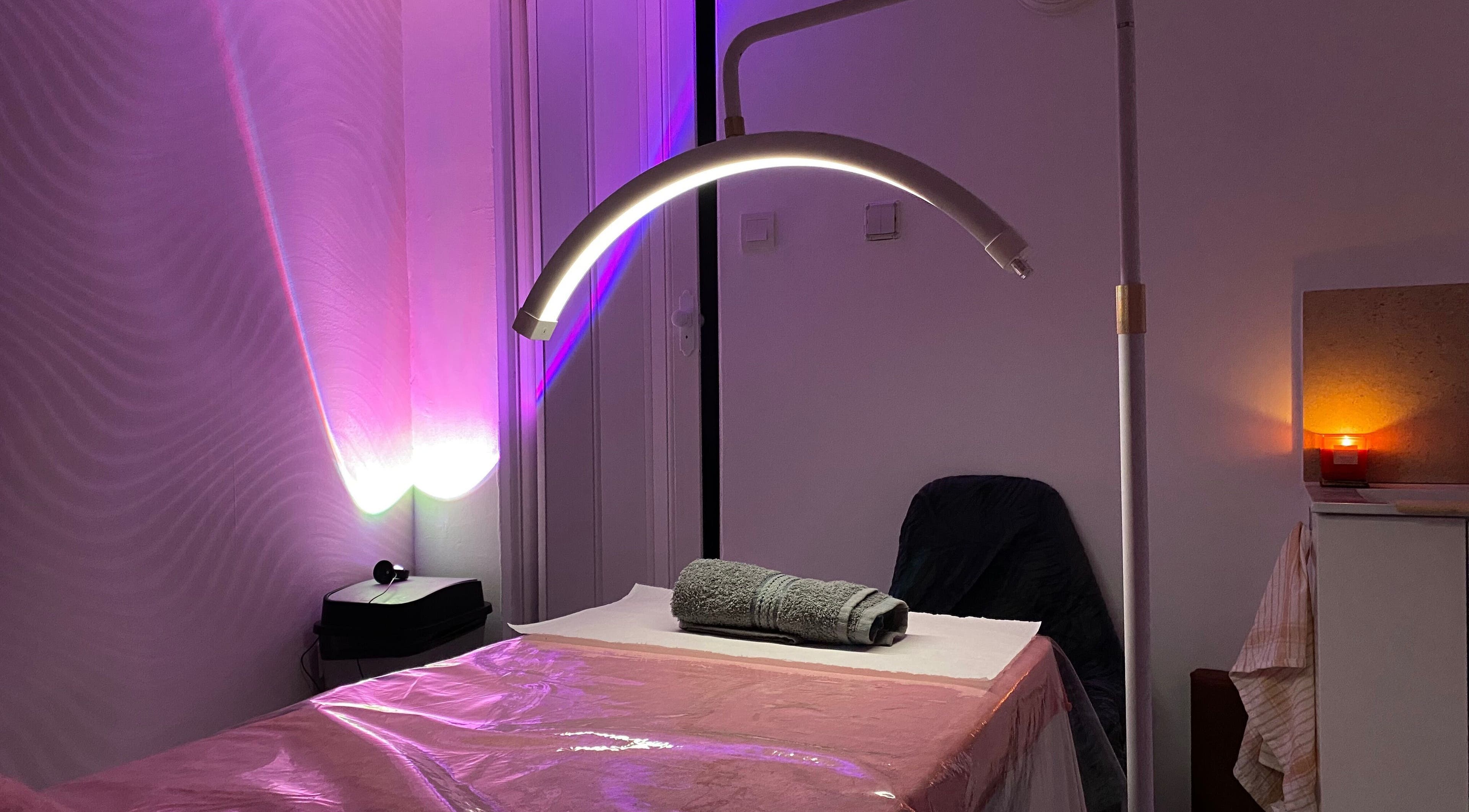 Relaxing spa room at Embracing Beauty, Iż-żejtun, MT with ambient lighting and massage table.