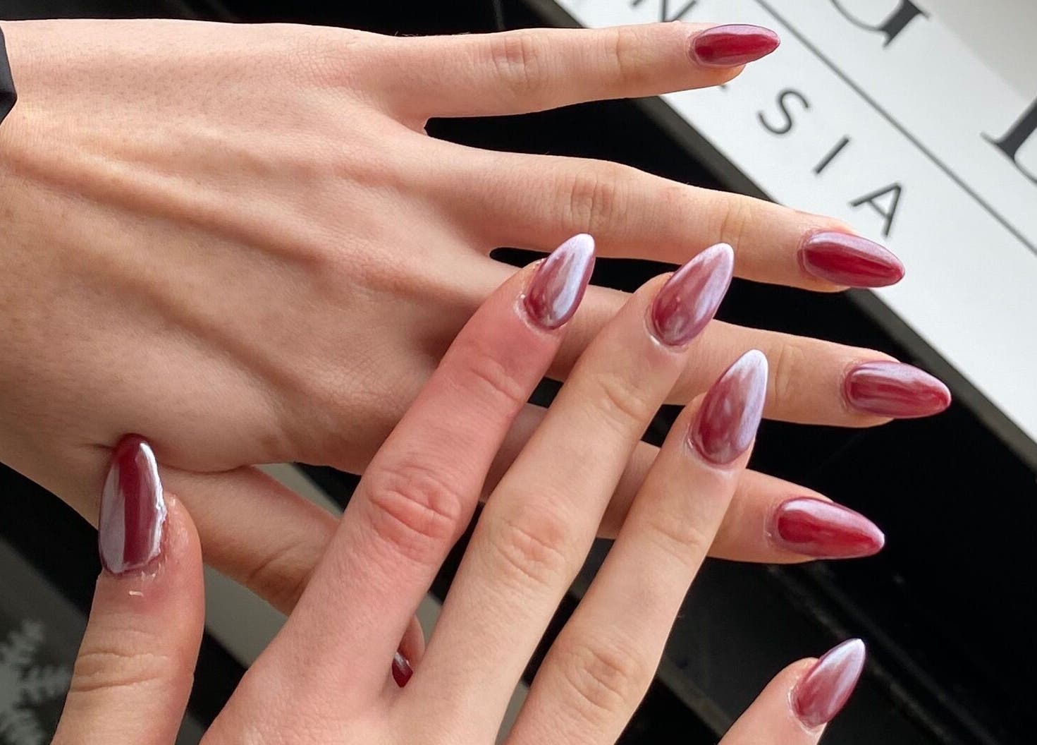 Elegant ombre manicure at Embracing Beauty, Iż-żejtun, MT. Showcasing stylish red nail designs.