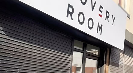 Exterior of The Recovery Room Oldham in Oldham, England, featuring a modern sign above the entrance.