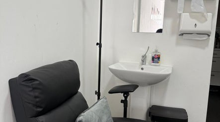 Relaxing treatment chair and sink at The Recovery Room Oldham, Oldham, England, GB, offering serenity.