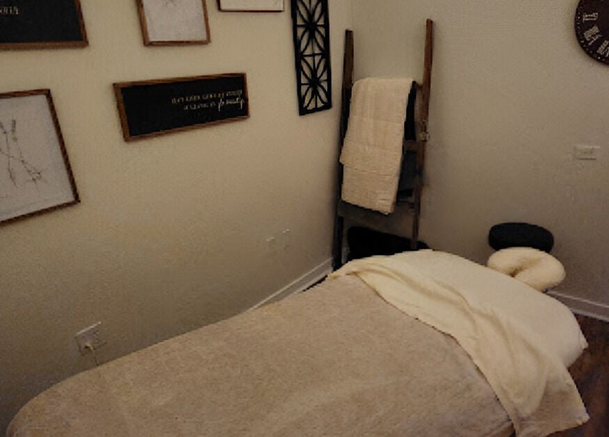 Cozy massage room at Sunny's Massage Therapy, Union City, Tennessee, US with soft lighting and decor.