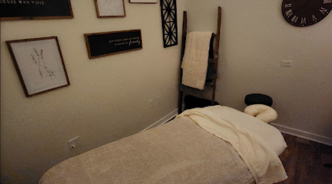 Cozy massage room at Sunny's Massage Therapy, Union City, Tennessee, US with soft lighting and decor.