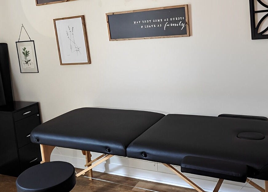 Sunny's Massage Therapy in Union City, Tennessee offers a tranquil room with a black massage table for relaxation.