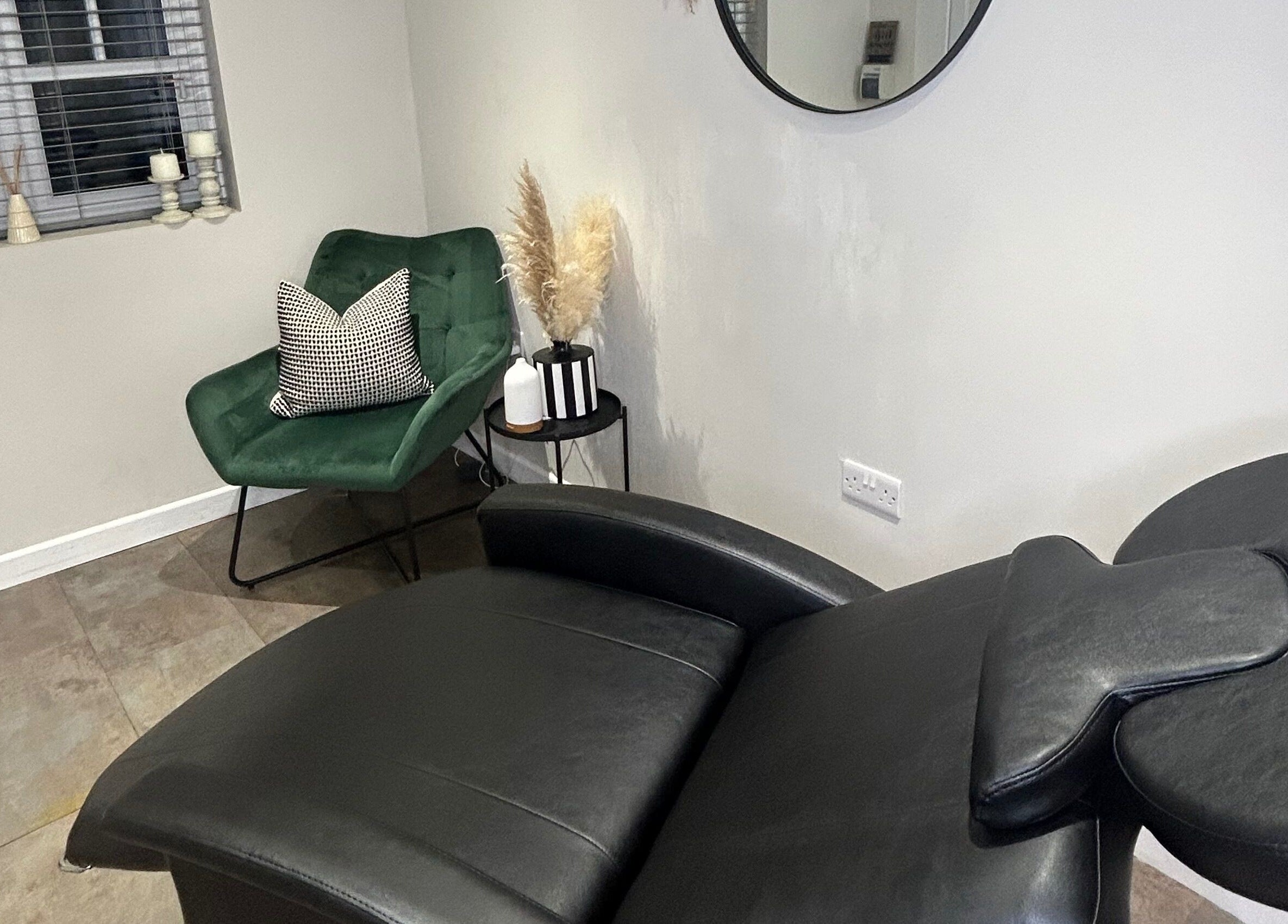 Relaxing interior at The Brow Box, Donington le Heath, England, GB, with plush chairs and decor.