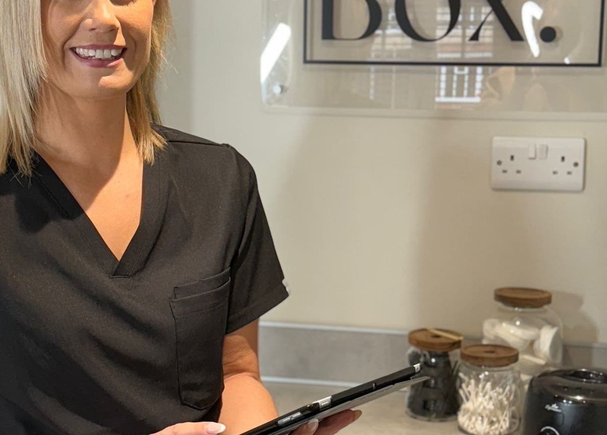 Smiling beauty specialist at The Brow Box, Donington le Heath, England, GB, ready to assist.