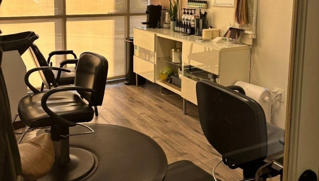 Interior of Elletic Salon Suite in Brea, California, US showcasing stylish chairs and sleek decor.