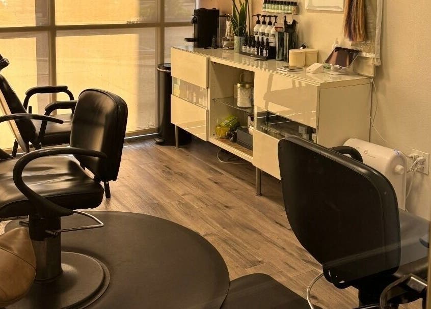 Interior of Elletic Salon Suite in Brea, California, US showcasing stylish chairs and sleek decor.