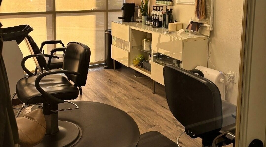 Interior of Elletic Salon Suite in Brea, California, US showcasing stylish chairs and sleek decor.