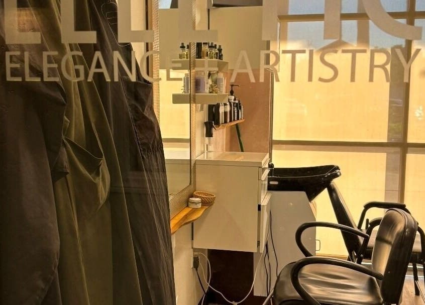 Interior view of Elletic Salon Suite in Brea, California, US, featuring modern styling chairs and products.