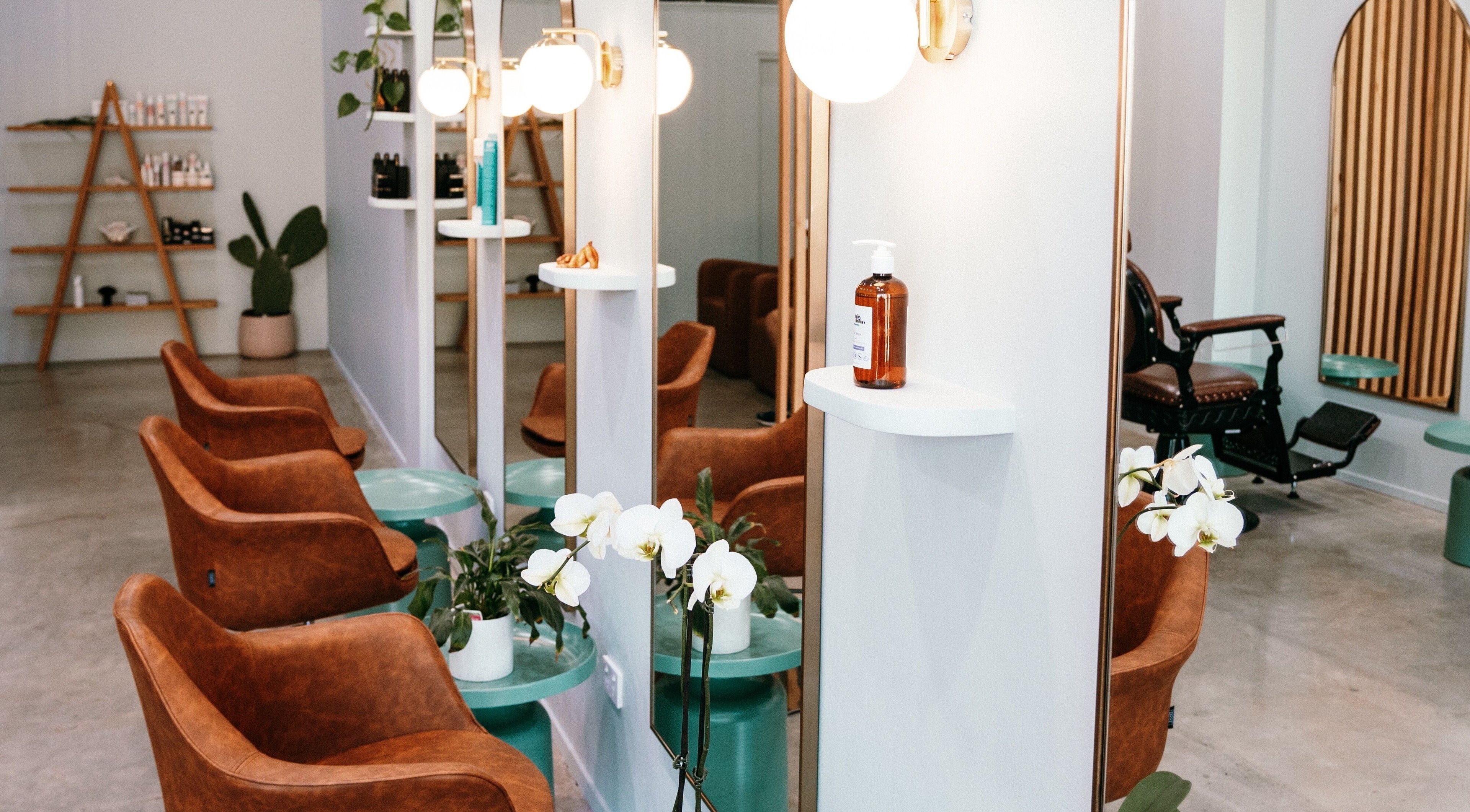 Inviting salon interior at Jade + Co. Salon, Paddington, NSW, AU, with stylish chairs and modern decor.