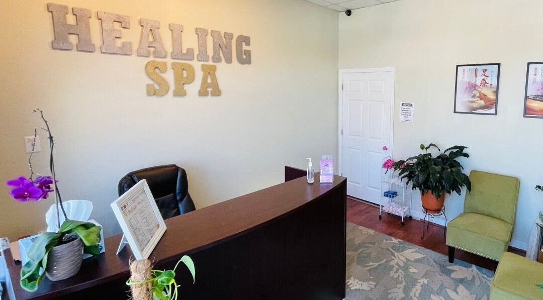 Welcome desk at Healing Spa, Midlothian, Virginia, US, with comfortable seating and decorative plants.