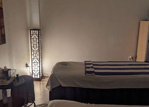 Calming massage room at Healing Spa, Midlothian, Virginia, US with a softly lit ambiance.