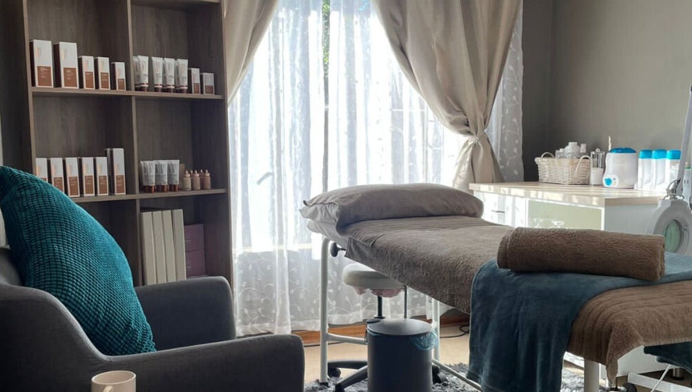 Belle Amé beauty salon in Centurion, Gauteng, ZA, featuring a serene treatment room with a cozy spa bed.