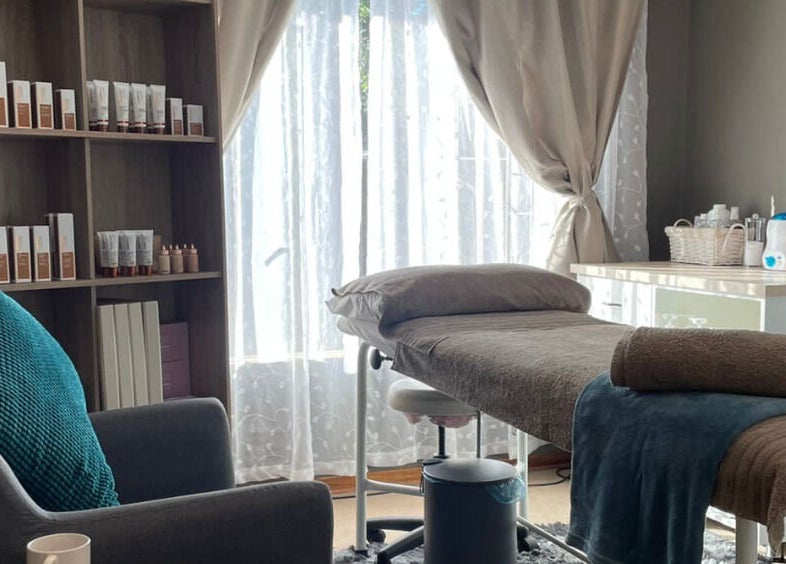 Belle Amé beauty salon in Centurion, Gauteng, ZA, featuring a serene treatment room with a cozy spa bed.