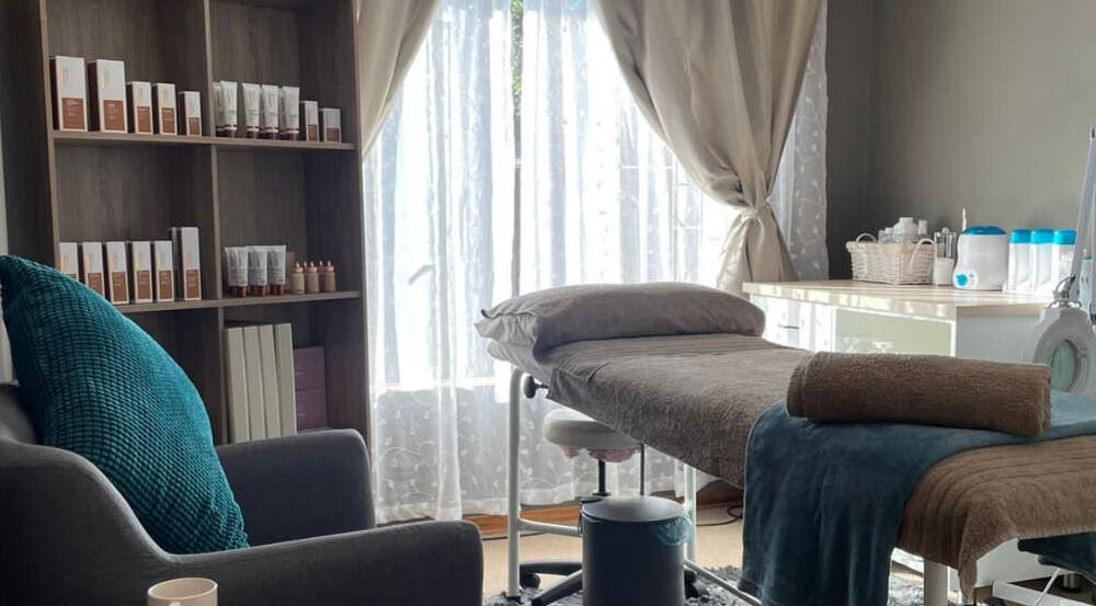 Belle Amé beauty salon in Centurion, Gauteng, ZA, featuring a serene treatment room with a cozy spa bed.