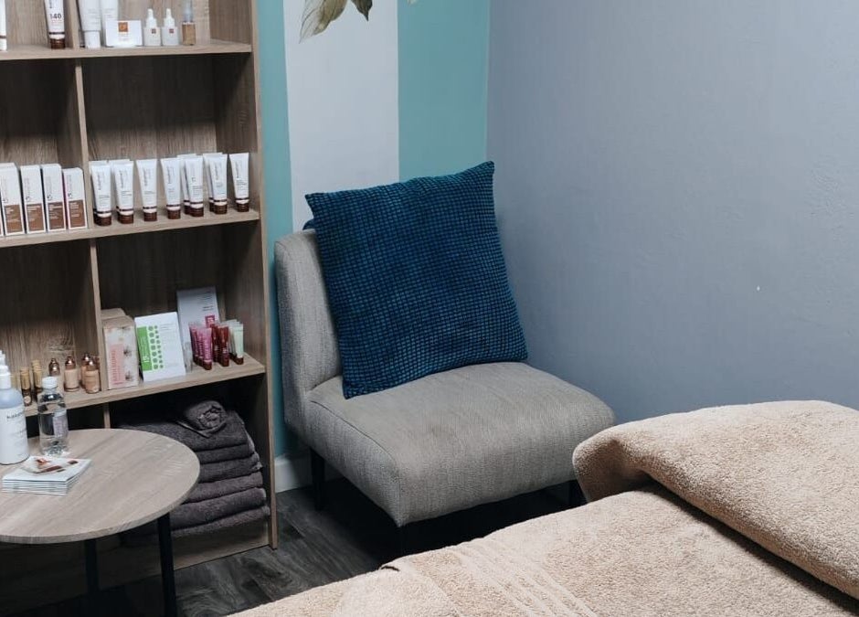 Relaxing treatment room at Belle Amé beauty salon in Centurion, Gauteng, ZA with comfy chair and skincare products.