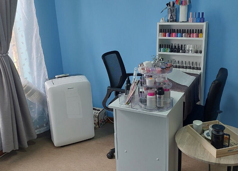 Cozy nail care corner at Belle Amé beauty salon, Centurion, Gauteng, ZA, featuring vibrant nail polishes and tools.