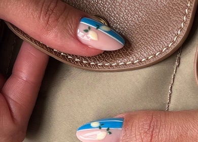 Stylish lemon-themed nail art at Pop Up Well Chiswick, London, England, GB showcasing vibrant and creative designs.
