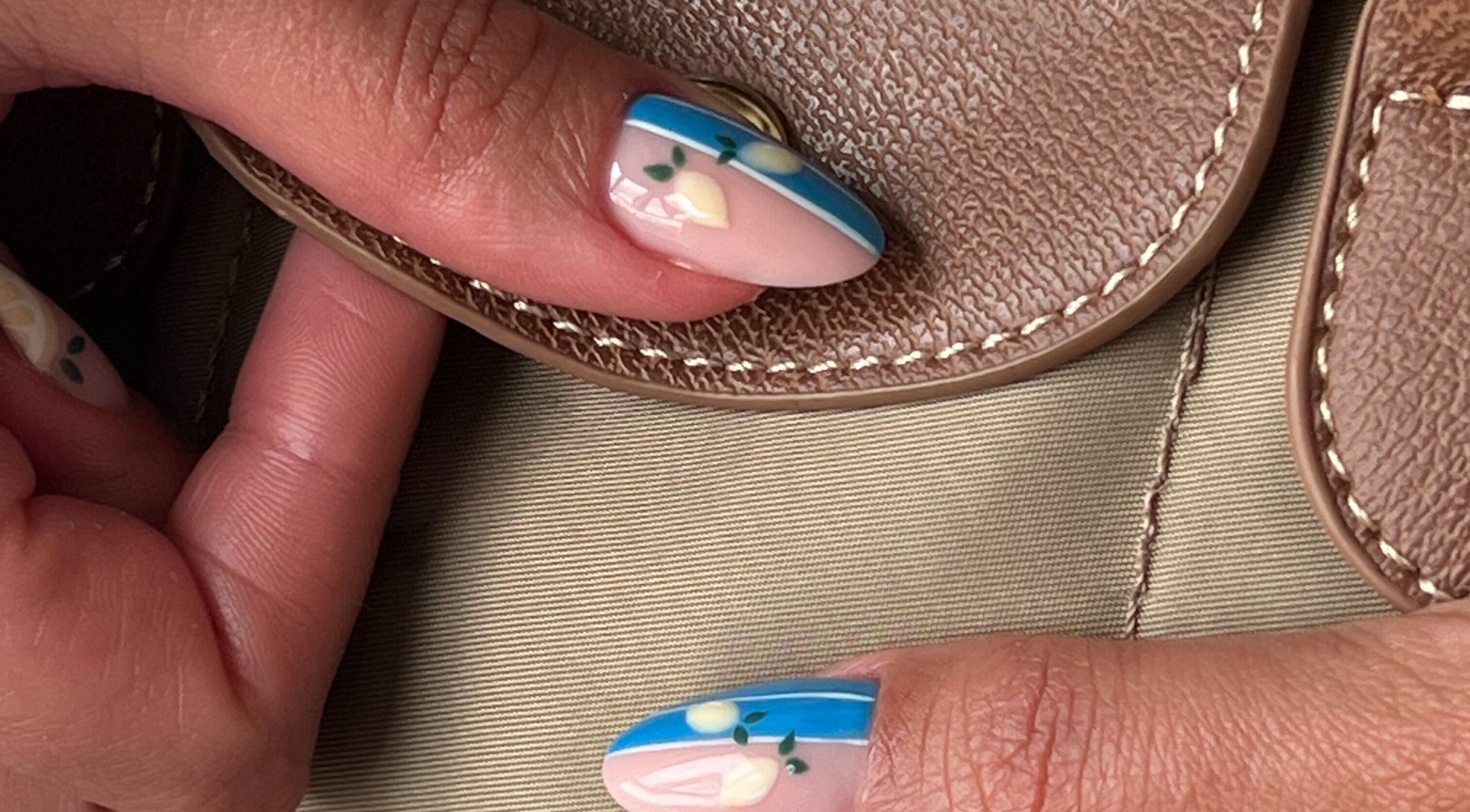 Stylish lemon-themed nail art at Pop Up Well Chiswick, London, England, GB showcasing vibrant and creative designs.