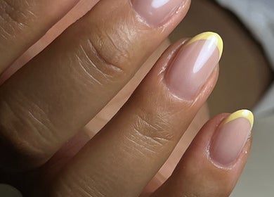 Elegant yellow French manicure nails at Pop Up Well Chiswick, London, England, GB.