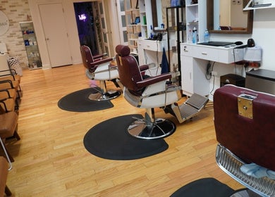 Elegant styling chairs at All That Beauty Bar, Ottawa, Ontario, CA, showcasing comfort and modern design.