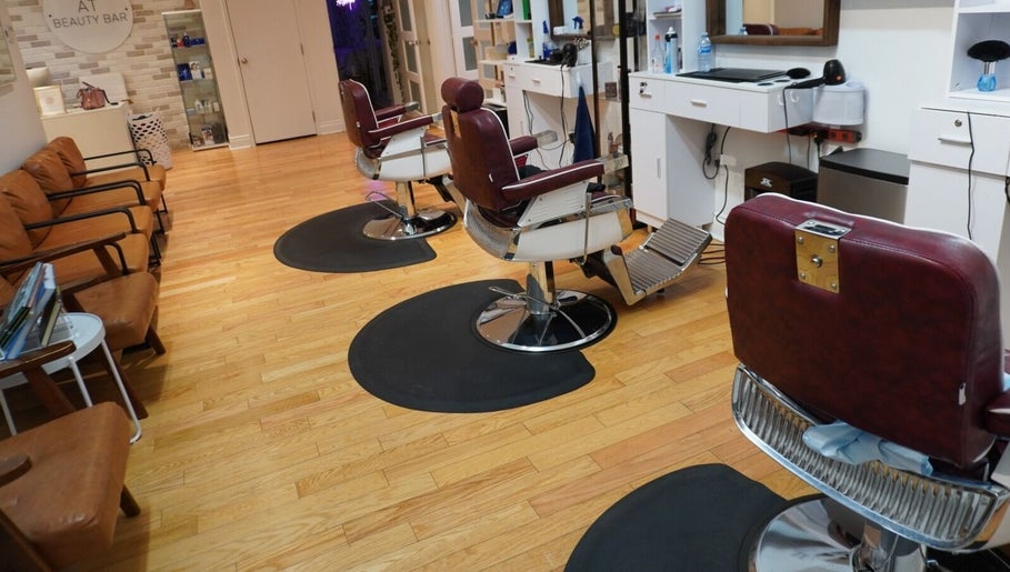 Cozy salon chairs at All That Beauty Bar, Ottawa, Ontario, CA with a chic, modern interior.
