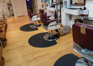 Cozy salon chairs at All That Beauty Bar, Ottawa, Ontario, CA with a chic, modern interior.